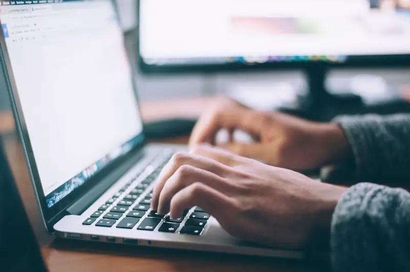 Freelance writer working from home on a laptop
