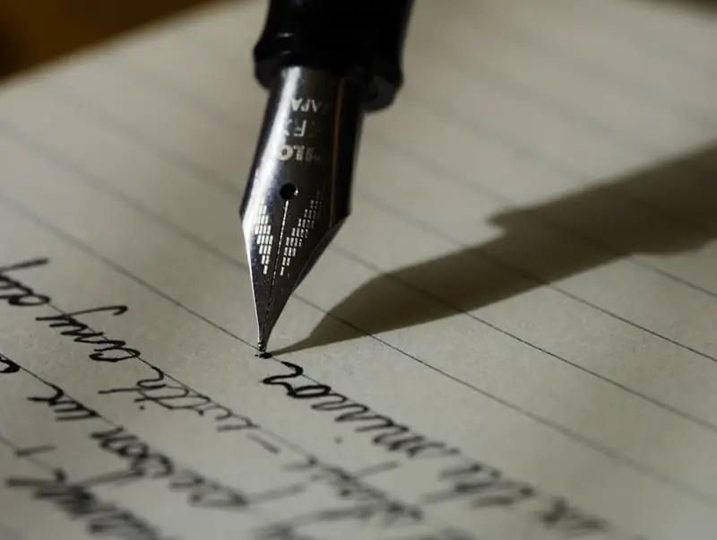 Writer taking notes while learning professional writing skills
